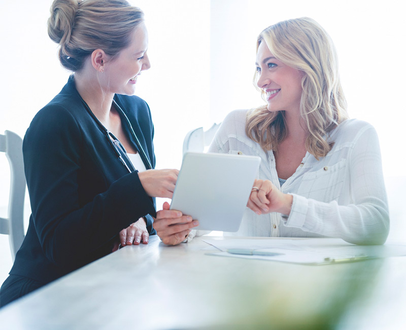 RejuvinAge staff member guiding a patient through her personalized care plan