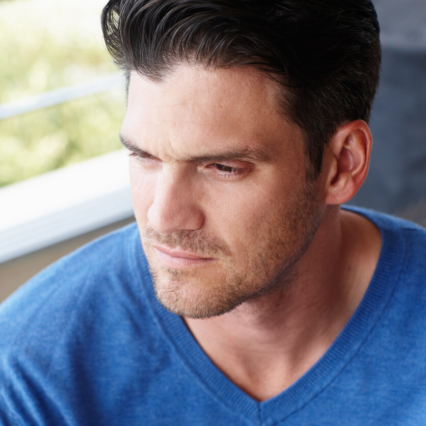 Man learning about low testosterone symptoms and how hormone balance can restore vitality