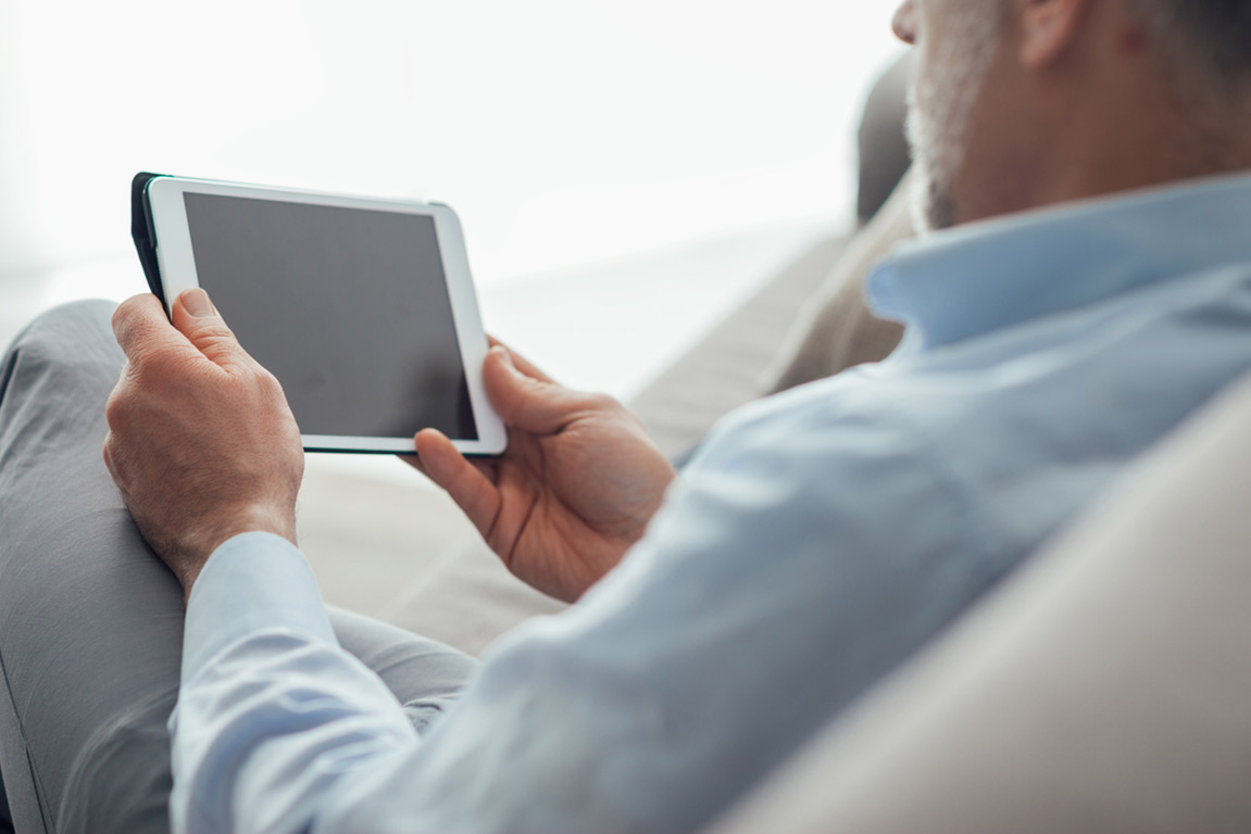 Man reading about the latest developments in testosterone therapy and men's health