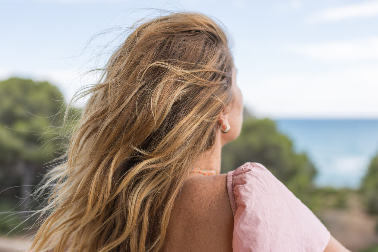 Woman looking out toward the horizon, taking charge of her health and wellnes