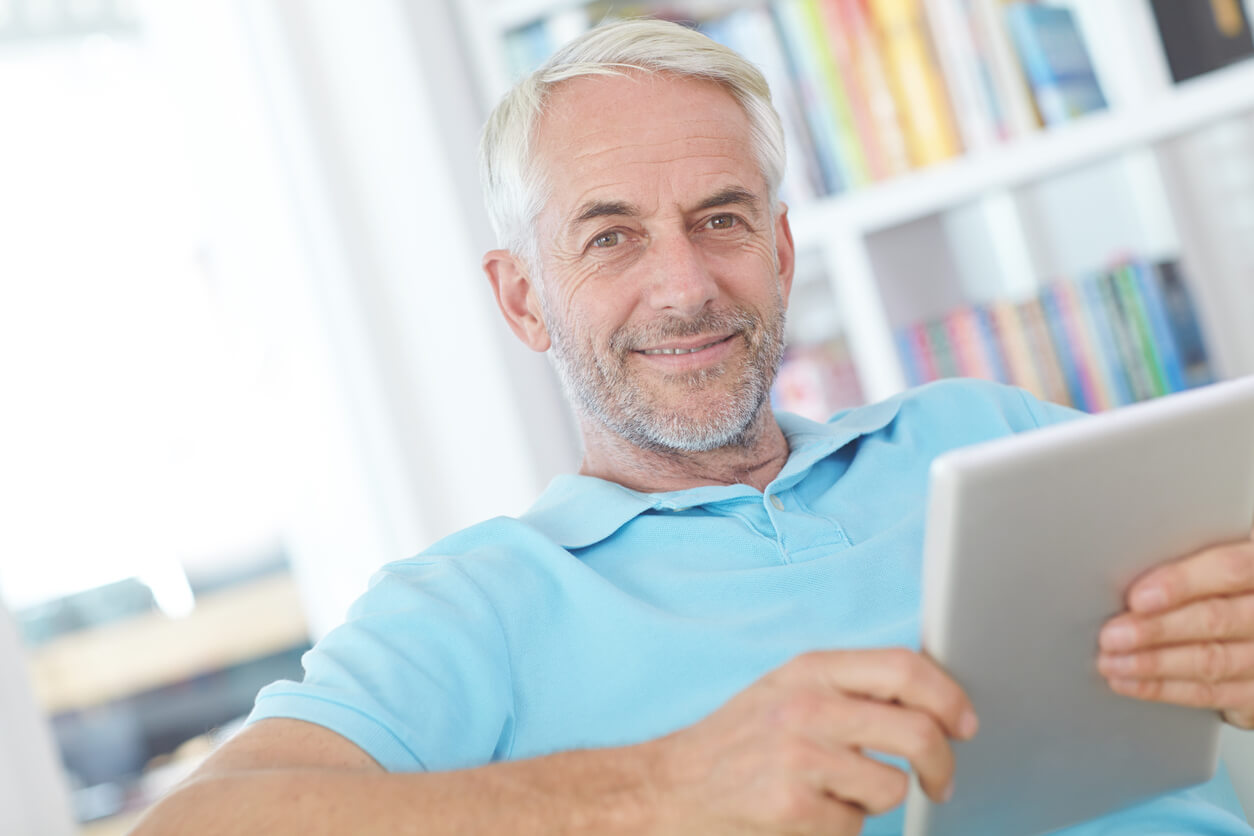 Mature man staying informed about testosterone therapy and men's health